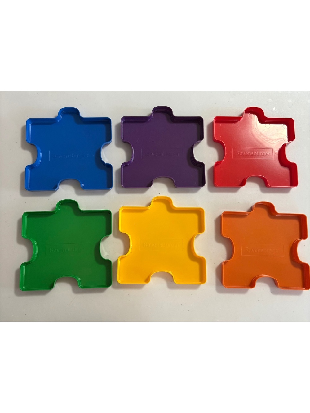 Colored puzzle piece sorting trays